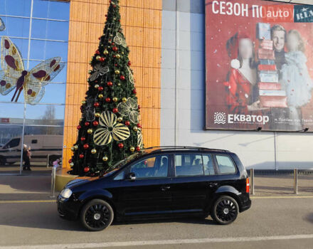 Черный Фольксваген Туран, объемом двигателя 1.6 л и пробегом 219 тыс. км за 5850 $, фото 1 на Automoto.ua