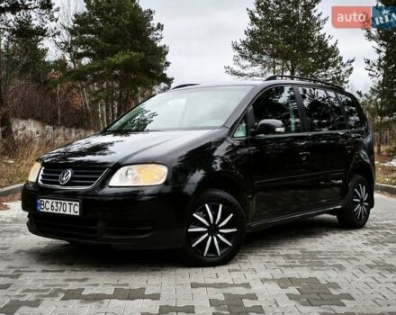 Черный Фольксваген Туран, объемом двигателя 2 л и пробегом 321 тыс. км за 5500 $, фото 1 на Automoto.ua