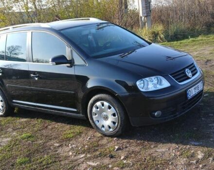 Черный Фольксваген Туран, объемом двигателя 2 л и пробегом 290 тыс. км за 6000 $, фото 1 на Automoto.ua