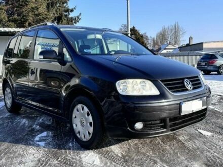 Черный Фольксваген Туран, объемом двигателя 2 л и пробегом 280 тыс. км за 5500 $, фото 1 на Automoto.ua