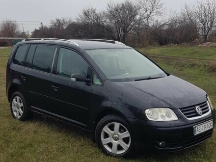 Черный Фольксваген Туран, объемом двигателя 2 л и пробегом 224 тыс. км за 4500 $, фото 1 на Automoto.ua