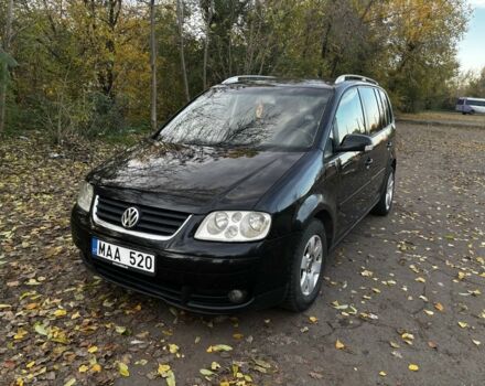 Чорний Фольксваген Туран, об'ємом двигуна 2 л та пробігом 346 тис. км за 3600 $, фото 1 на Automoto.ua