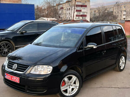 Черный Фольксваген Туран, объемом двигателя 1.6 л и пробегом 229 тыс. км за 6450 $, фото 1 на Automoto.ua