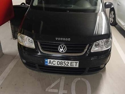 Чорний Фольксваген Туран, об'ємом двигуна 1.97 л та пробігом 291 тис. км за 7000 $, фото 1 на Automoto.ua