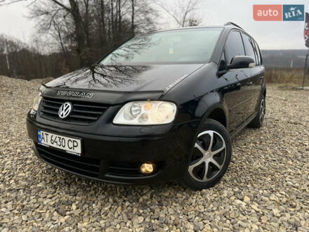 Черный Фольксваген Туран, объемом двигателя 1.9 л и пробегом 285 тыс. км за 6200 $, фото 1 на Automoto.ua