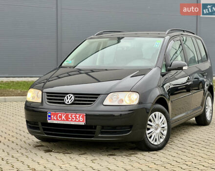 Черный Фольксваген Туран, объемом двигателя 1.6 л и пробегом 249 тыс. км за 5999 $, фото 1 на Automoto.ua