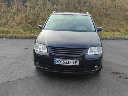 Черный Фольксваген Туран, объемом двигателя 2 л и пробегом 301 тыс. км за 6700 $, фото 1 на Automoto.ua