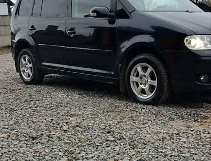 Черный Фольксваген Туран, объемом двигателя 1.97 л и пробегом 343 тыс. км за 5500 $, фото 1 на Automoto.ua