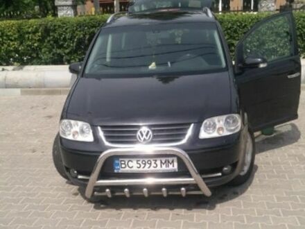 Чорний Фольксваген Туран, об'ємом двигуна 2 л та пробігом 290 тис. км за 5900 $, фото 1 на Automoto.ua