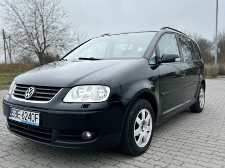Черный Фольксваген Туран, объемом двигателя 2 л и пробегом 310 тыс. км за 2950 $, фото 1 на Automoto.ua
