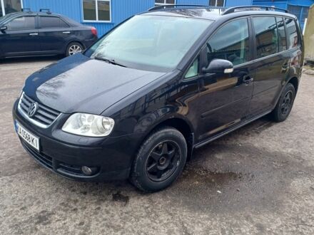 Черный Фольксваген Туран, объемом двигателя 1.9 л и пробегом 450 тыс. км за 4999 $, фото 1 на Automoto.ua