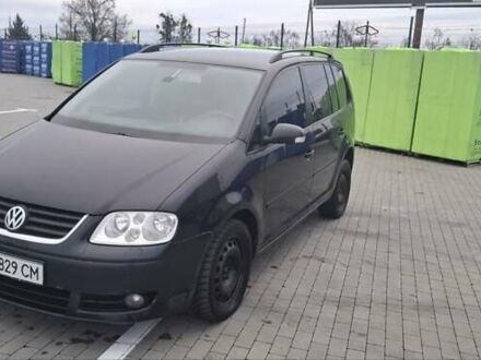 Черный Фольксваген Туран, объемом двигателя 2 л и пробегом 485 тыс. км за 4300 $, фото 1 на Automoto.ua