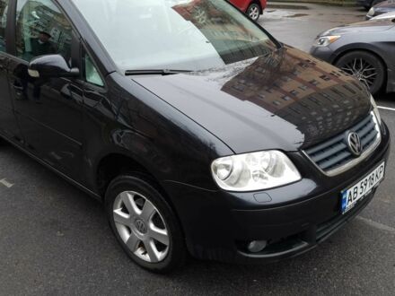 Черный Фольксваген Туран, объемом двигателя 1.4 л и пробегом 239 тыс. км за 5700 $, фото 1 на Automoto.ua