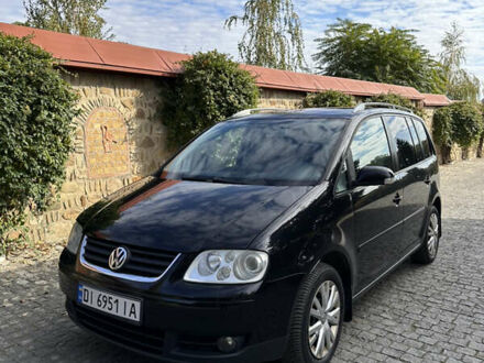 Черный Фольксваген Туран, объемом двигателя 2 л и пробегом 281 тыс. км за 5199 $, фото 1 на Automoto.ua