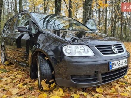 Черный Фольксваген Туран, объемом двигателя 1.39 л и пробегом 278 тыс. км за 5200 $, фото 1 на Automoto.ua