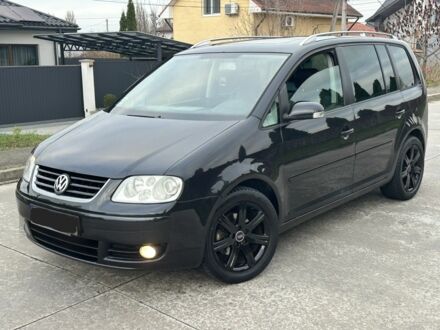 Черный Фольксваген Туран, объемом двигателя 2 л и пробегом 111 тыс. км за 4000 $, фото 1 на Automoto.ua
