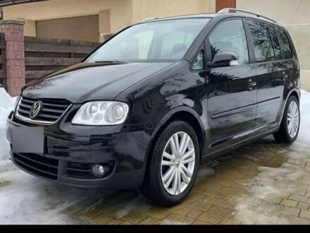 Черный Фольксваген Туран, объемом двигателя 2 л и пробегом 220 тыс. км за 7500 $, фото 1 на Automoto.ua