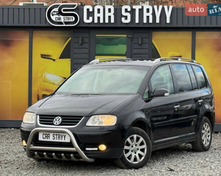 Черный Фольксваген Туран, объемом двигателя 2 л и пробегом 350 тыс. км за 5900 $, фото 1 на Automoto.ua