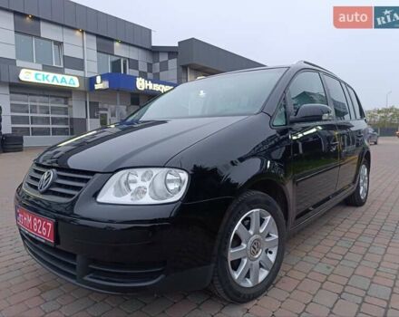 Черный Фольксваген Туран, объемом двигателя 1.6 л и пробегом 186 тыс. км за 5999 $, фото 1 на Automoto.ua