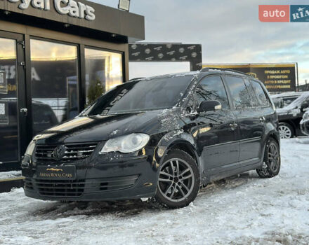 Черный Фольксваген Туран, объемом двигателя 1.39 л и пробегом 241 тыс. км за 8100 $, фото 1 на Automoto.ua