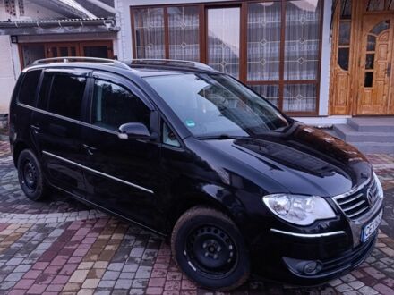 Чорний Фольксваген Туран, об'ємом двигуна 2 л та пробігом 320 тис. км за 6800 $, фото 1 на Automoto.ua