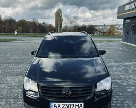 Черный Фольксваген Туран, объемом двигателя 1.39 л и пробегом 242 тыс. км за 7500 $, фото 1 на Automoto.ua