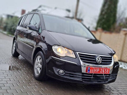 Черный Фольксваген Туран, объемом двигателя 1.4 л и пробегом 193 тыс. км за 6950 $, фото 1 на Automoto.ua