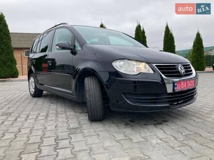 Черный Фольксваген Туран, объемом двигателя 1.4 л и пробегом 195 тыс. км за 6999 $, фото 1 на Automoto.ua