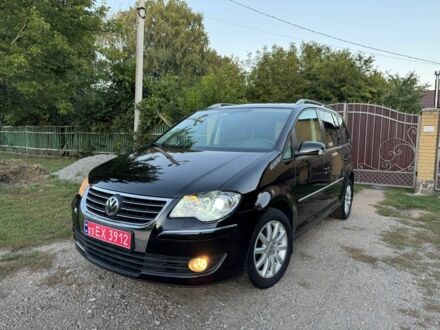 Черный Фольксваген Туран, объемом двигателя 1.4 л и пробегом 205 тыс. км за 7000 $, фото 1 на Automoto.ua