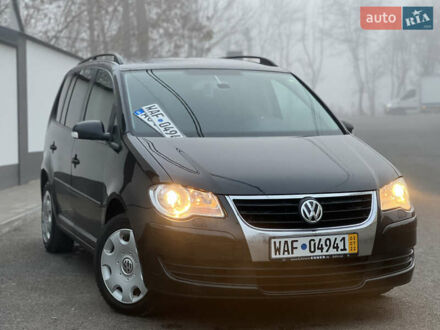 Чорний Фольксваген Туран, об'ємом двигуна 1.4 л та пробігом 248 тис. км за 7199 $, фото 1 на Automoto.ua