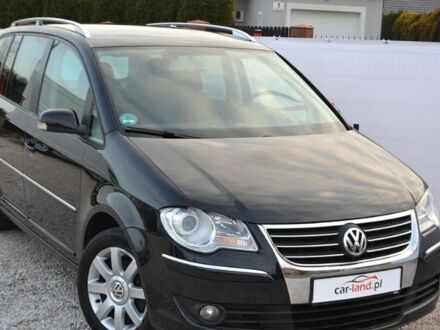 Черный Фольксваген Туран, объемом двигателя 2 л и пробегом 216 тыс. км за 5399 $, фото 1 на Automoto.ua