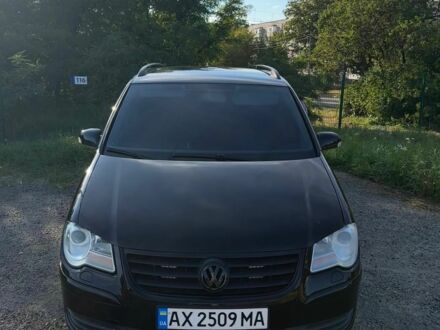 Черный Фольксваген Туран, объемом двигателя 1.4 л и пробегом 242 тыс. км за 7000 $, фото 1 на Automoto.ua