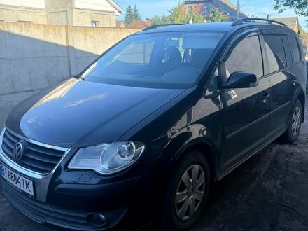 Черный Фольксваген Туран, объемом двигателя 1.4 л и пробегом 250 тыс. км за 4500 $, фото 1 на Automoto.ua