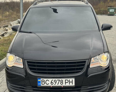 Черный Фольксваген Туран, объемом двигателя 1.4 л и пробегом 247 тыс. км за 7500 $, фото 1 на Automoto.ua