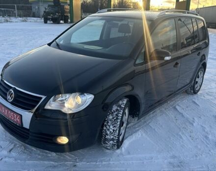 Черный Фольксваген Туран, объемом двигателя 1.4 л и пробегом 145 тыс. км за 8699 $, фото 1 на Automoto.ua