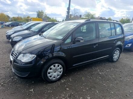 Черный Фольксваген Туран, объемом двигателя 1 л и пробегом 217 тыс. км за 7200 $, фото 1 на Automoto.ua