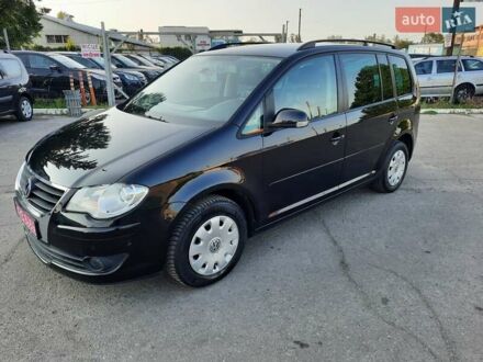 Черный Фольксваген Туран, объемом двигателя 1.6 л и пробегом 213 тыс. км за 8550 $, фото 1 на Automoto.ua