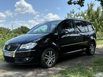 Черный Фольксваген Туран, объемом двигателя 1.4 л и пробегом 191 тыс. км за 8500 $, фото 1 на Automoto.ua
