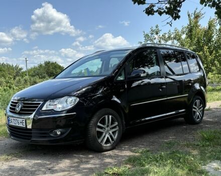 Черный Фольксваген Туран, объемом двигателя 1.4 л и пробегом 191 тыс. км за 8500 $, фото 1 на Automoto.ua