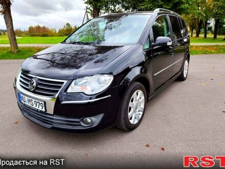 Фольксваген Туран 2008 в Павлограде на Automoto.ua Черный Фольксваген Туран, объемом двигателя 2 л и пробегом 318 тыс. км за 2400 $, фото 1 на Automoto.ua