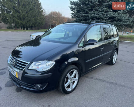 Черный Фольксваген Туран, объемом двигателя 1.4 л и пробегом 224 тыс. км за 6499 $, фото 1 на Automoto.ua