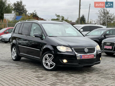 Черный Фольксваген Туран, объемом двигателя 1.4 л и пробегом 195 тыс. км за 7600 $, фото 1 на Automoto.ua