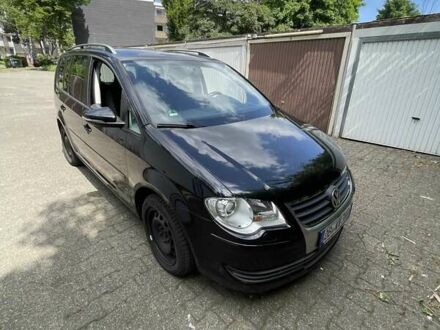 Черный Фольксваген Туран, объемом двигателя 1.4 л и пробегом 190 тыс. км за 5313 $, фото 1 на Automoto.ua