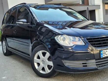 Черный Фольксваген Туран, объемом двигателя 1.97 л и пробегом 248 тыс. км за 8300 $, фото 1 на Automoto.ua