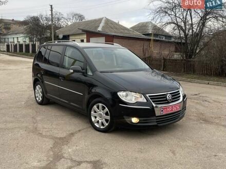 Черный Фольксваген Туран, объемом двигателя 1.4 л и пробегом 194 тыс. км за 6555 $, фото 1 на Automoto.ua