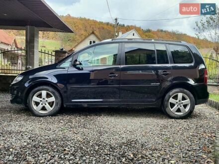 Черный Фольксваген Туран, объемом двигателя 1.4 л и пробегом 260 тыс. км за 6200 $, фото 1 на Automoto.ua