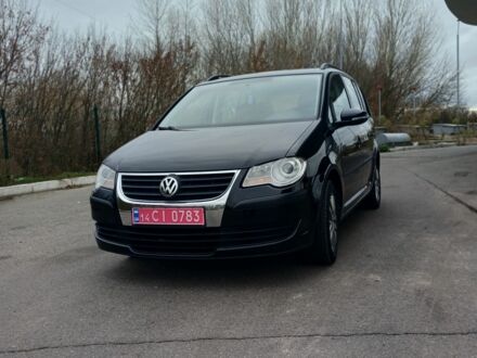 Черный Фольксваген Туран, объемом двигателя 1.6 л и пробегом 250 тыс. км за 7999 $, фото 1 на Automoto.ua