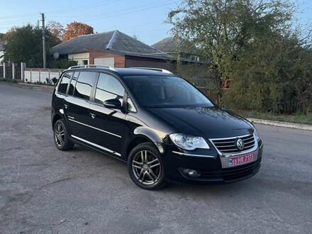 Черный Фольксваген Туран, объемом двигателя 1.4 л и пробегом 238 тыс. км за 7888 $, фото 1 на Automoto.ua