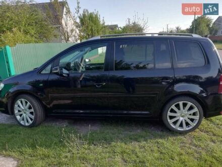 Фольксваген Туран 2010 в Чернобае на Automoto.ua Черный Фольксваген Туран, объемом двигателя 1.97 л и пробегом 258 тыс. км за 10821 $, фото 1 на Automoto.ua