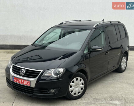 Черный Фольксваген Туран, объемом двигателя 1.4 л и пробегом 213 тыс. км за 8100 $, фото 1 на Automoto.ua